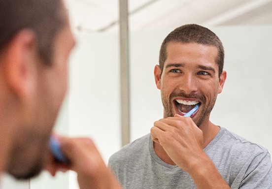 Jackson patient brushing teeth with fluoride toothpaste