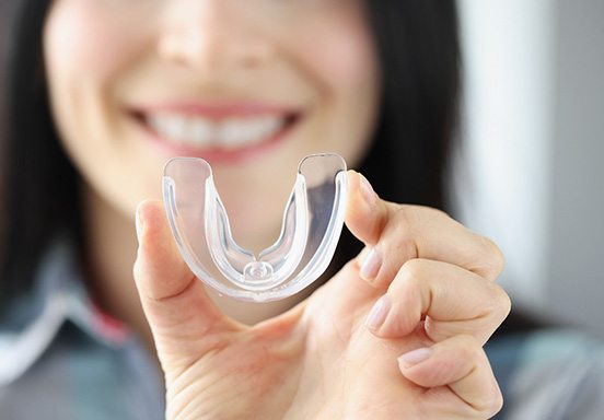 Jackson patient showing off mouthguard