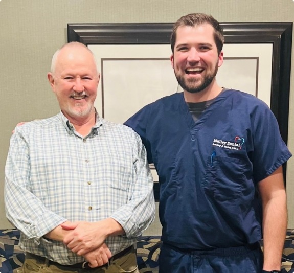 Doctor Malley and Doctor Abernathy smiling in Jackson dental office