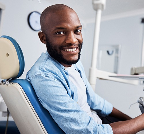 a patient smiling while visiting the dentist