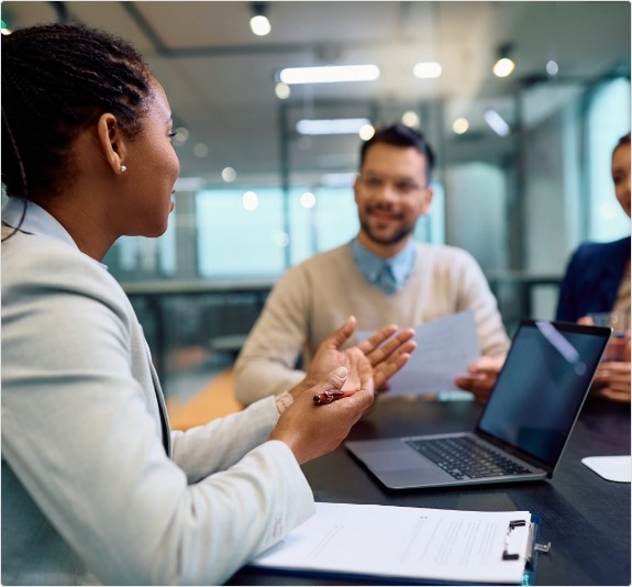 Group of office workers sitting at table