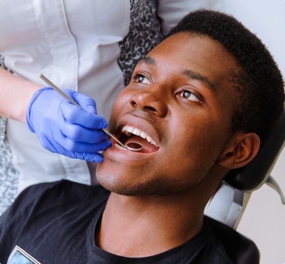 Man receiving a preventive dental checkup in Jackson