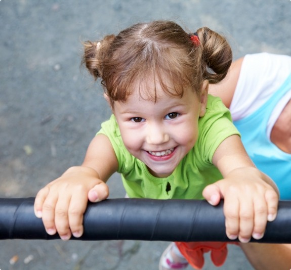 Smiling young girl on playground