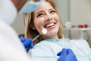 Woman smiling in dentist's chair.